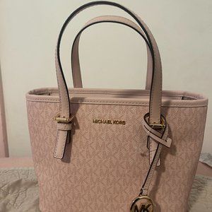 Brand new Michael Kors purse with tags on.